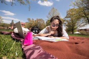 A female students studying on the mall